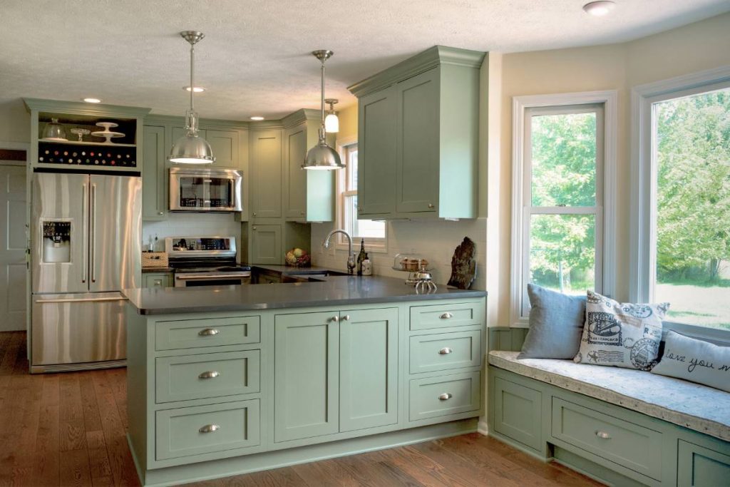 Williamston kitchen remodel with green cabinets and hardwood floors