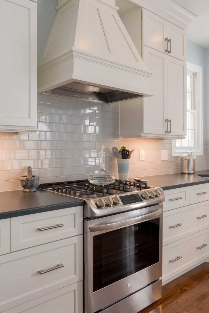 Tile backsplash with white kitchen cabinets