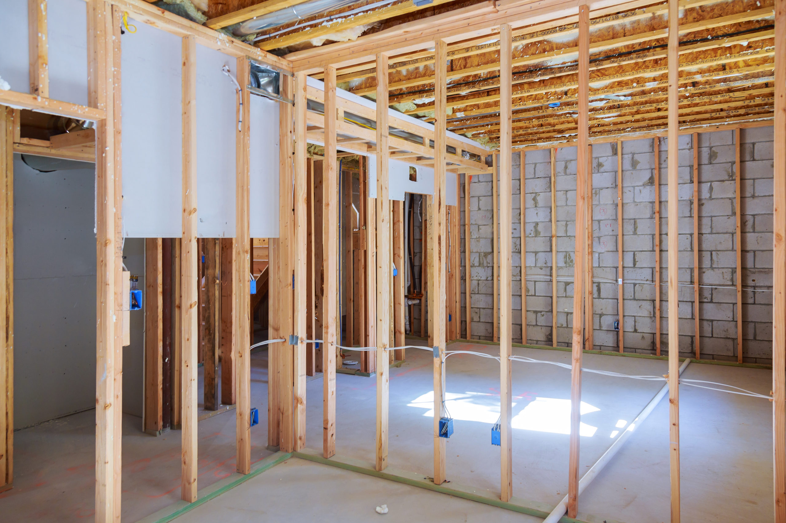 New under construction home framing unfinished wood frame building of a basement residential